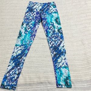 Ladies athletic leggings with a multi color design by Grata Designs Size small